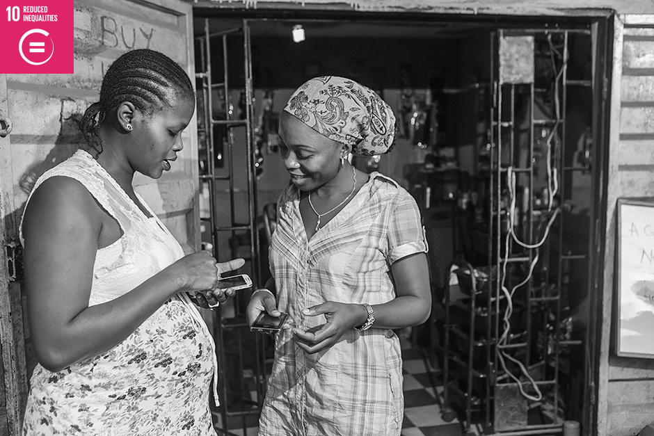 Photo Description:  Two program participants in YTF’s Women Entrepreneurs & Mobile Value Added Services program excitedly read a customized business message via SMS.  