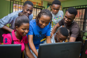 YTF youth look at a computer